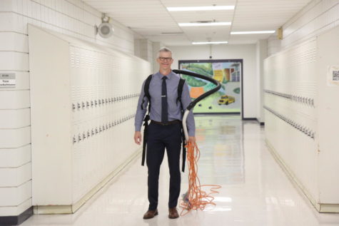 Head principal Cory Sink was spotted vacuuming classrooms in the language arts hallway, Sept. 14.