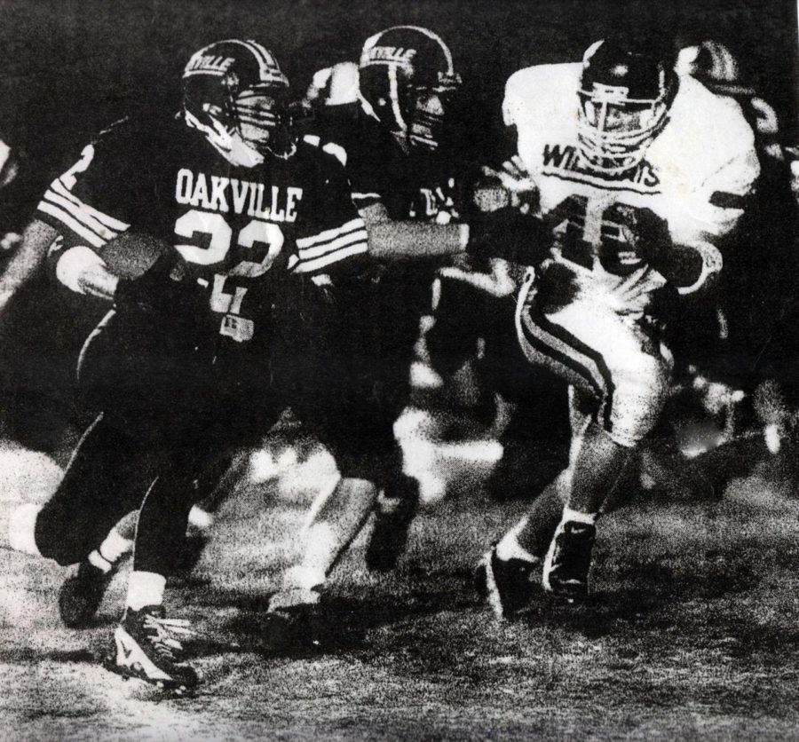 Andy Bedo runs down the field to tackle an Oakville player, Sept. 29, 1995. 