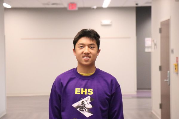 Mark Li poses for photo in his Chess Club sweatshirt.