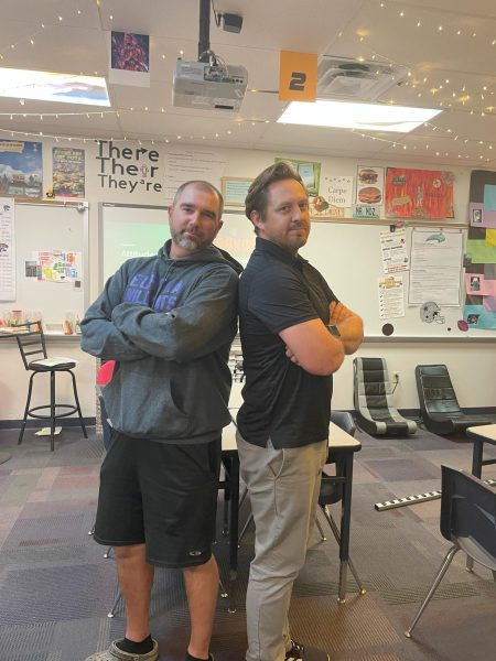 PJ Arway and Mark Mosley stand together inside Mosley's classroom.