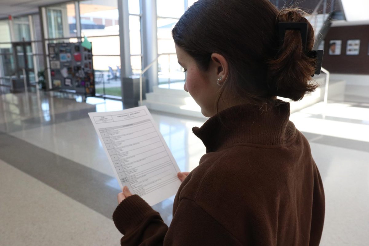April Porter, 11, looks at a school schedule.