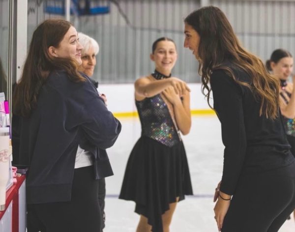 Linehan cheers on her students in the rink. Photo courtsey of Addison Quinley.